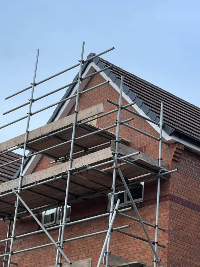 This is a photo of a roof which has just been repaired. There is a scaffold located at the gable end for access onto the roof. Works carried out by MCM Roofing Repairs Warminster